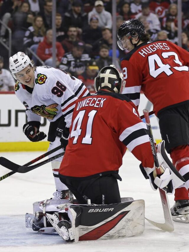 Bedard departs after big hit as Blackhawks lose to Devils